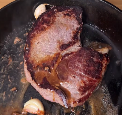 Step 3.1: Cook the steak to your preferred doneness and baste with garlic and butter for added flavor
