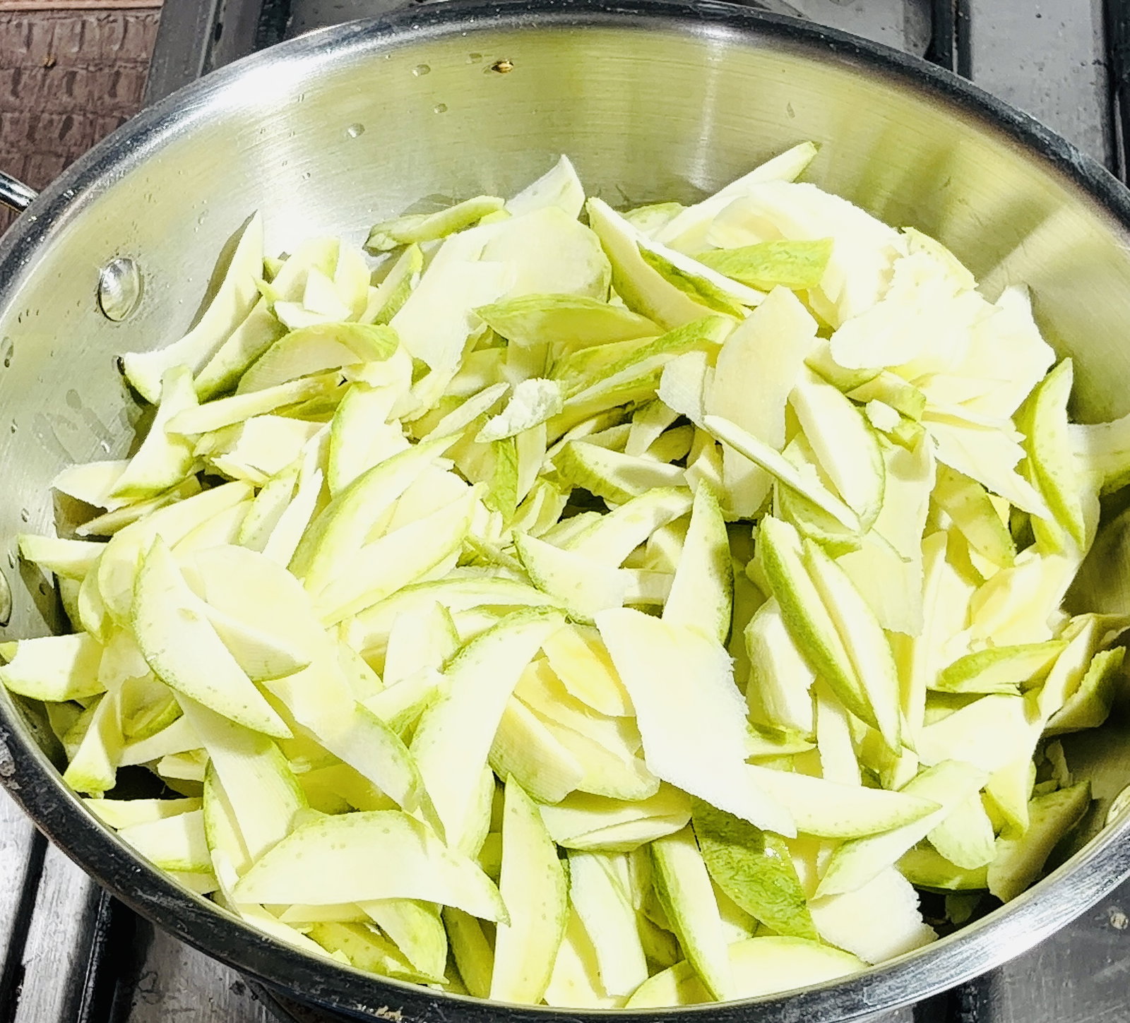 Step 2.1: Add the mangoes and stir for 4-5 minutes until they slightly change colour