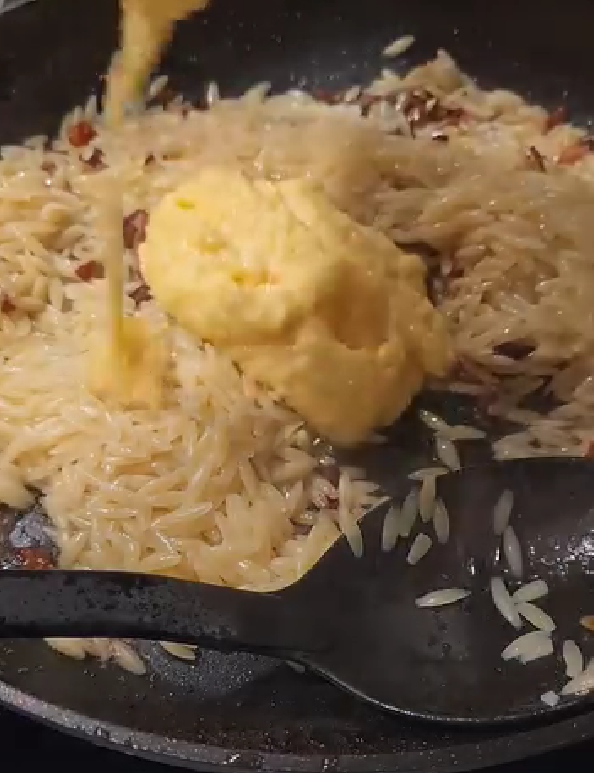 Step 1.1: Add the egg and parmesan mixture to the pan and stir quickly