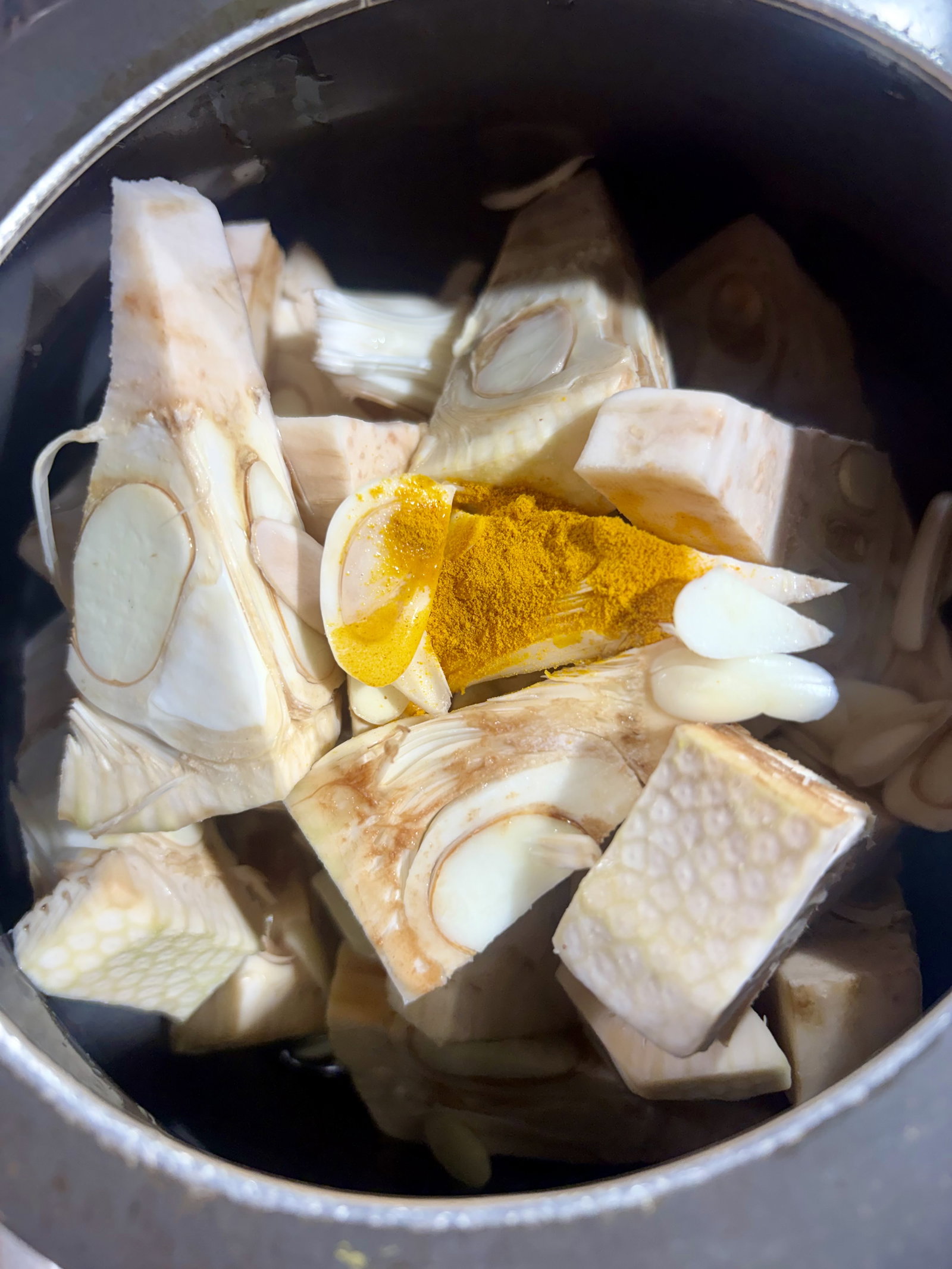 Step 1.1: Add jackfruit, water, and turmeric to a pressure cooker