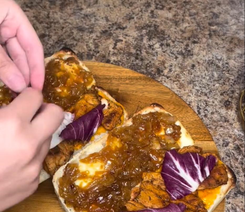 Step 3.1: Assemble the sandwich using bread of your choice, mozzarella slices, red Leicester cheese slices, spicy mayo, and lettuce, adding the cooked chicken and caramelised onions