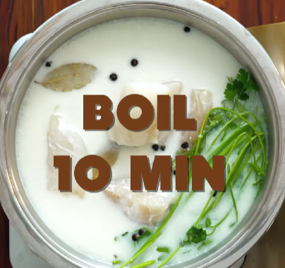 Step 3.1: Gently poach the cod fillet in milk with the bay leaf and juniper berries for about 6 minutes