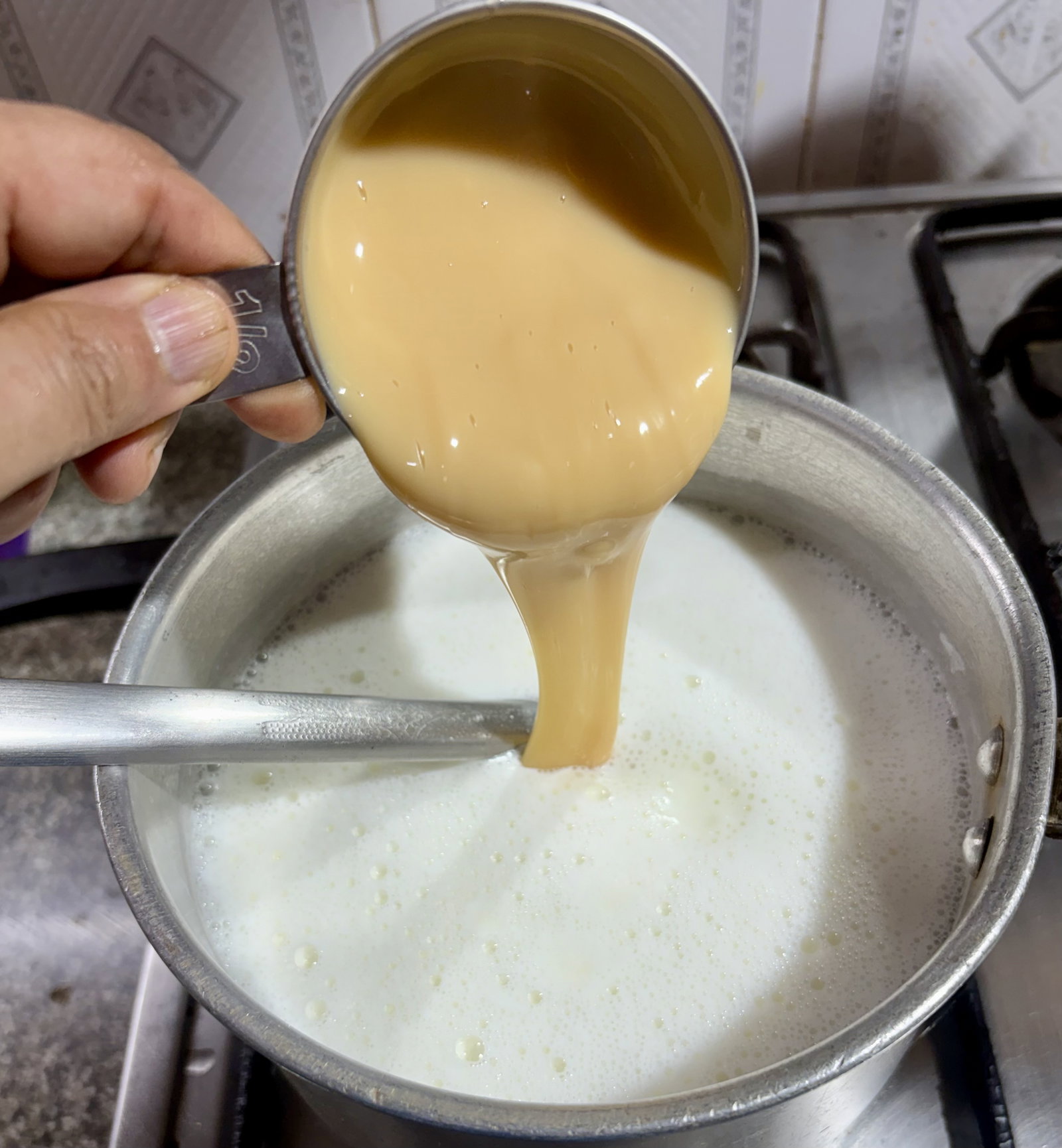 Step 1.1: Bring the full-fat milk to a gentle boil in a heavy-bottomed pan