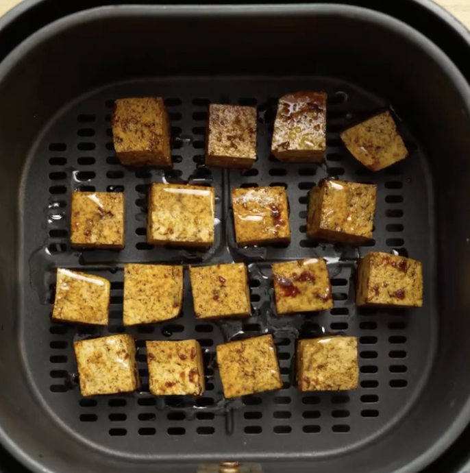 Step 2.1: Toss tofu in the marinade, then air-fry for 12 minutes at 180°C (356°F) until golden and crispy
