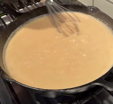 Step 3.1: Add milk and simmer until the gravy is thick but pourable
