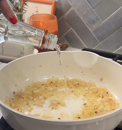 Step 1.1: Pour in Tito’s Vodka and let it simmer for 1-2 minutes to cook off the alcohol