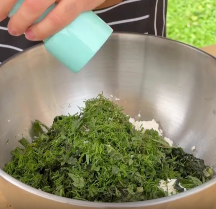Step 1.1: In a bowl, crumble the feta cheese and mix with the spinach, herbs, and roasted garlic