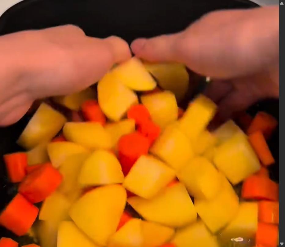 Step 1.1: Add potatoes and carrots to the baking dish, mixing to coat the vegetables in the sauce