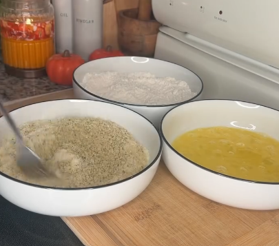 Step 1.1: Set up three bowls: one with flour, salt, and pepper; one with beaten eggs; and one with panko and grated parmesan