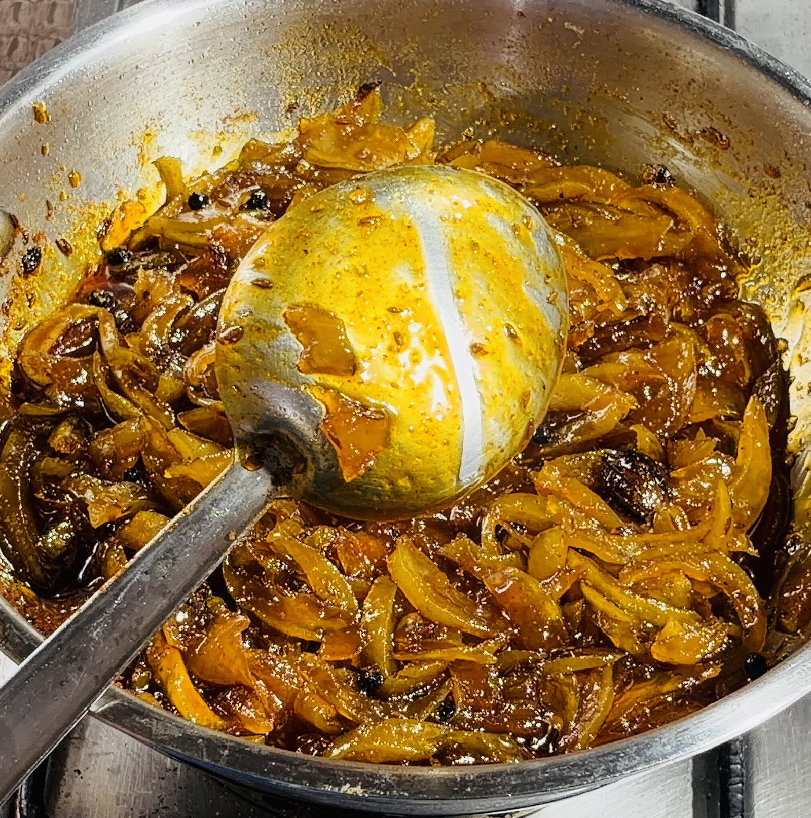 Step 2.2: Simmer stirring occasionally, until the mangoes soften further and the sugar syrup thickens