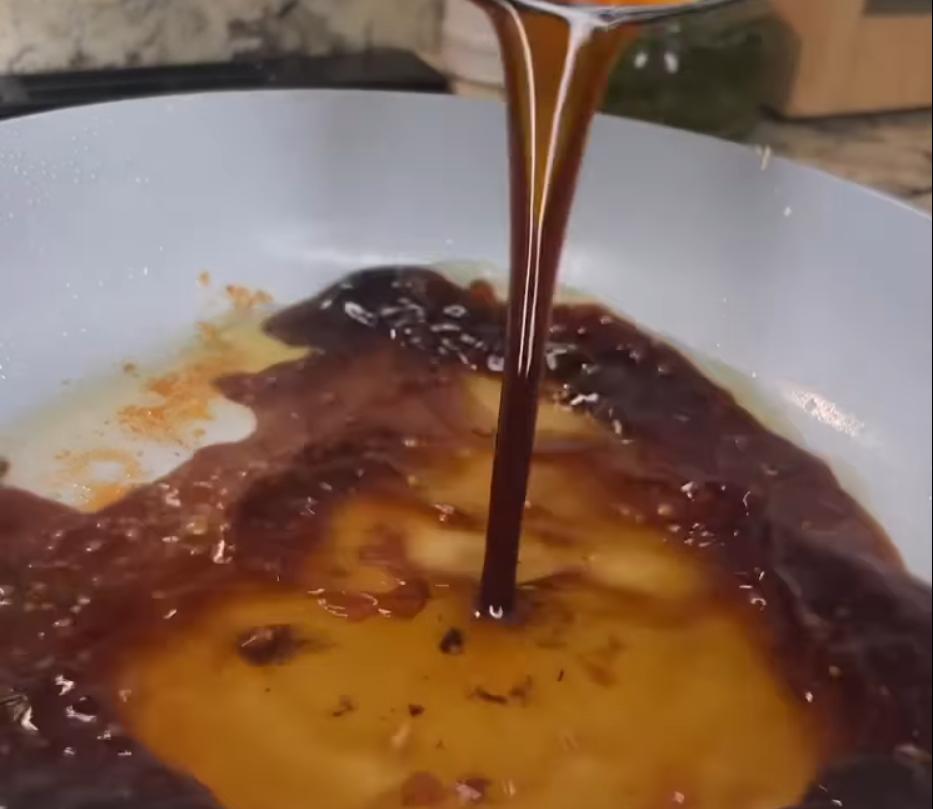 Step 2.1: Add the soy sauce, honey, sesame oil, minced garlic, and ginger paste to the pan
