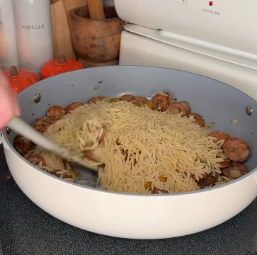 Step 1.1: Mix in orzo and stir, cooking for 1 minute