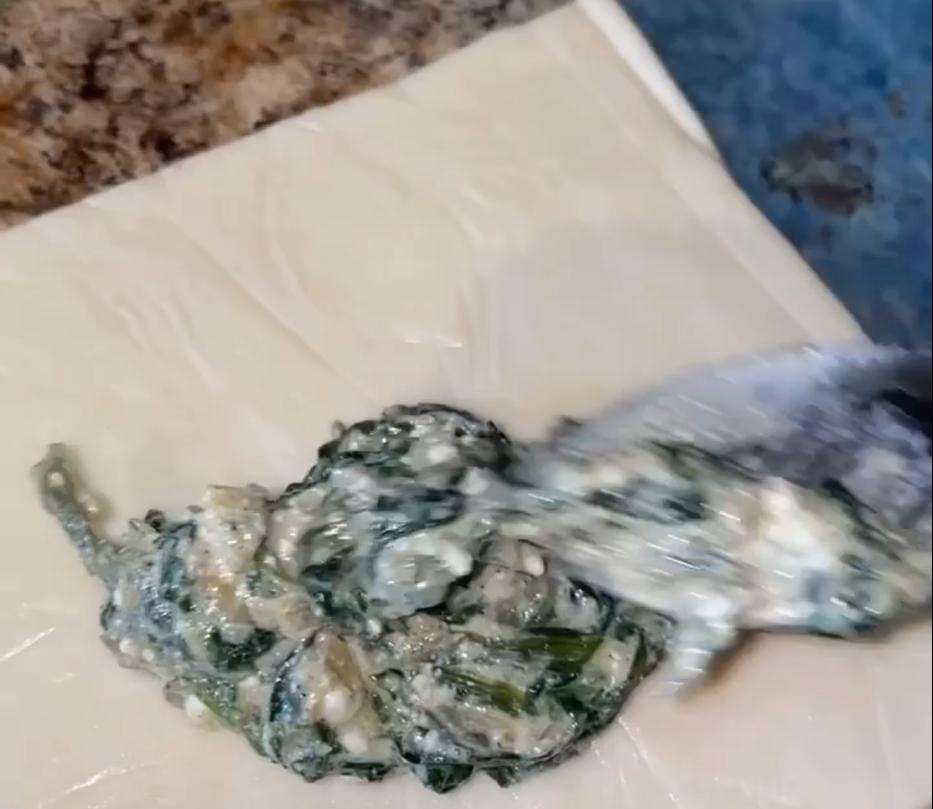Step 1.1: Spoon the spinach and feta filling onto each piece of pastry
