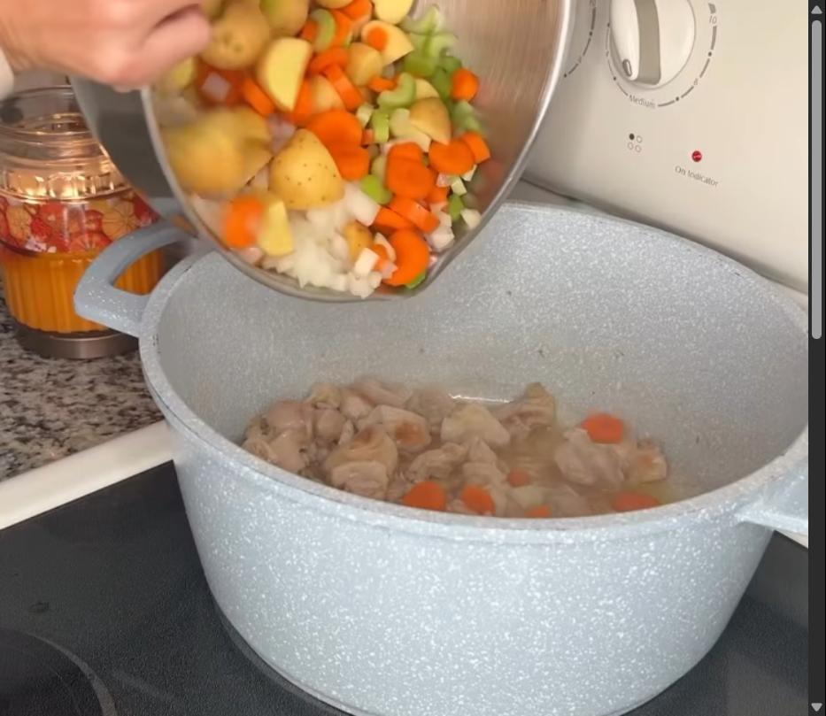 Step 2.1: Add the diced onion, chopped carrots, chopped celery, garlic, thyme, rosemary, salt, pepper, and 2 tablespoons of flour to the pot