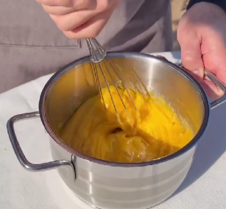 Step 1.1: Add egg yolks and whisk until pale and smooth