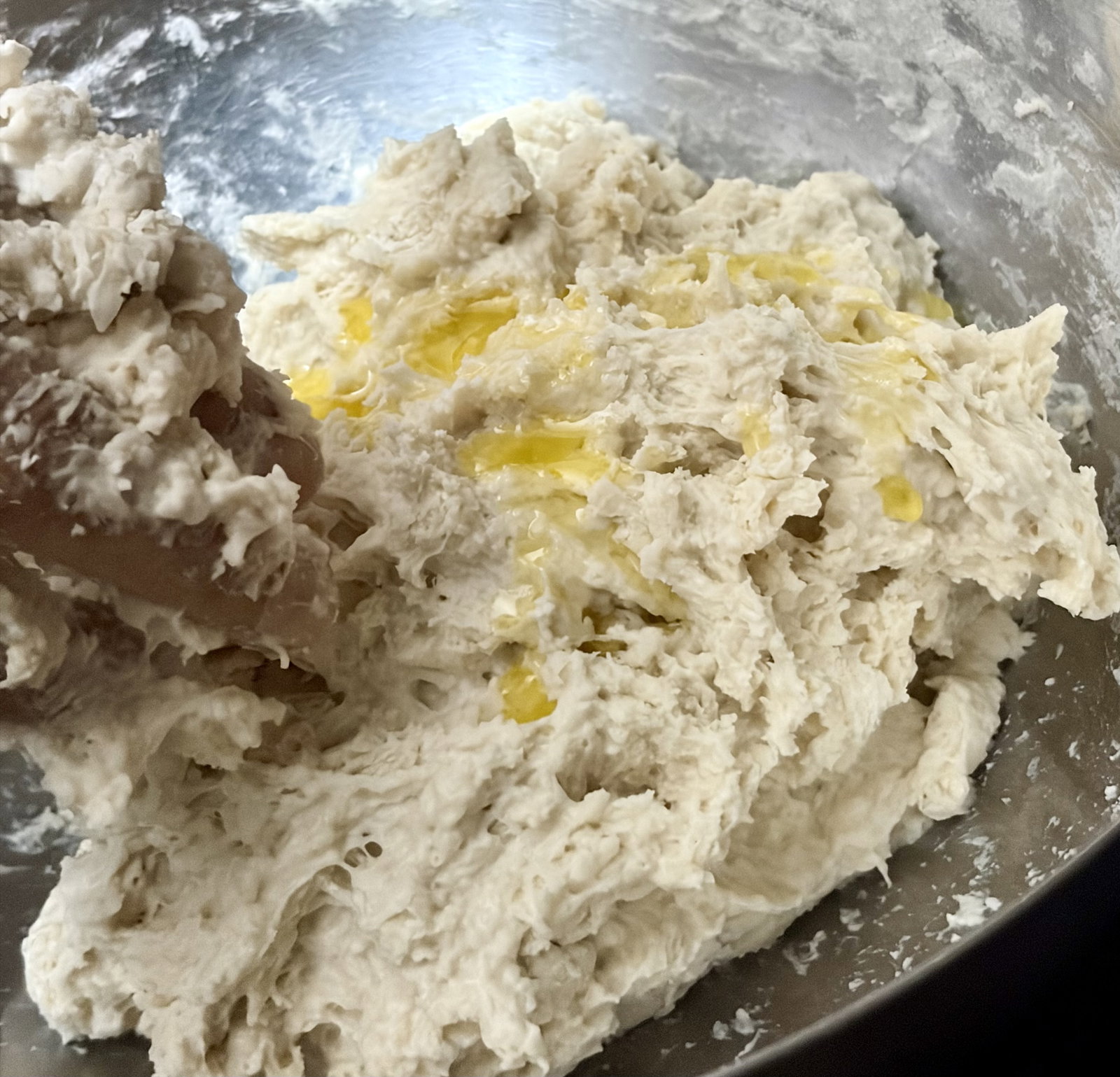 Step 2.1: Add melted butter and knead vigorously for 8–10 minutes until the dough becomes smooth and elastic