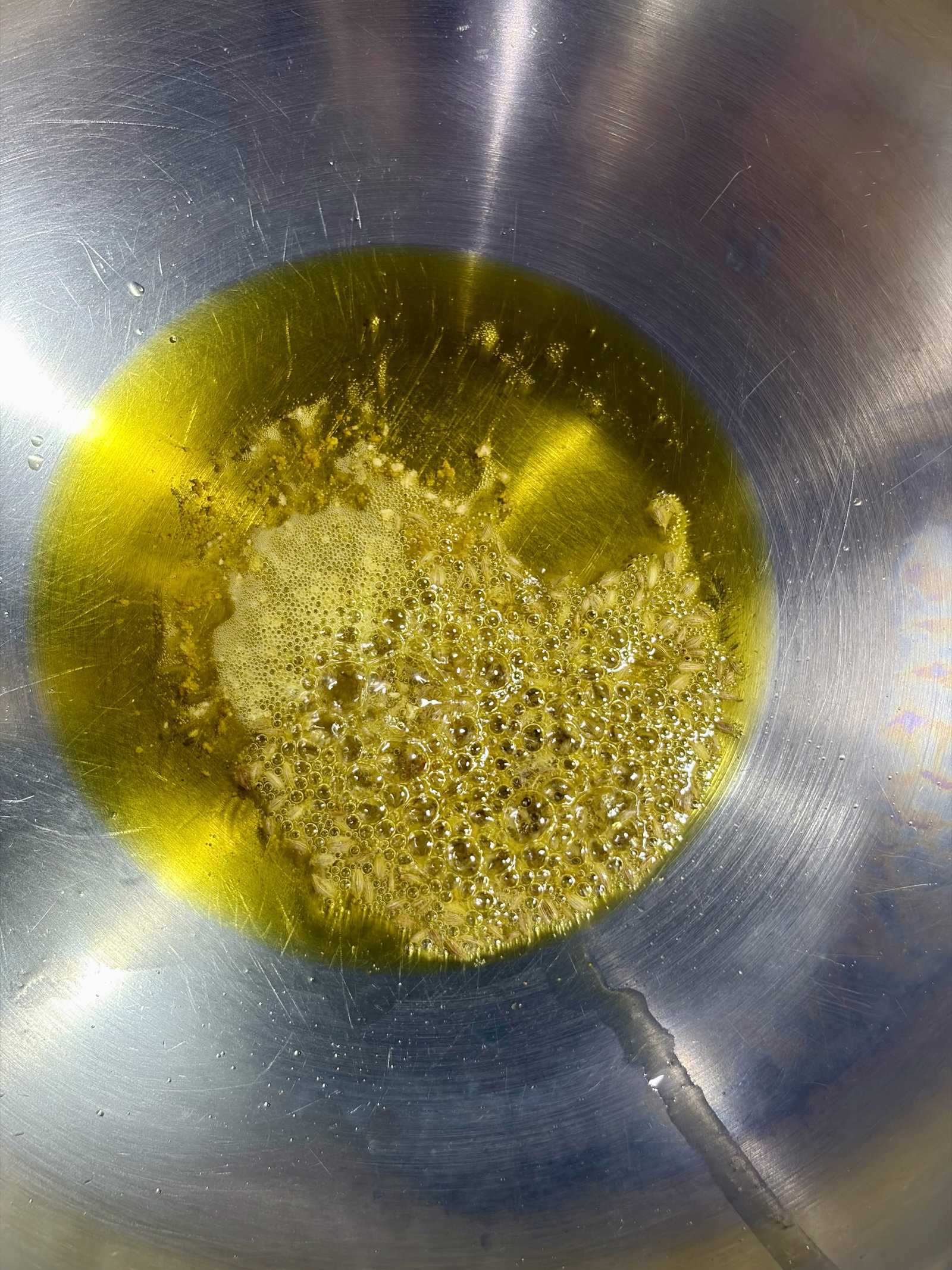 Step 4.1: Add hing and cumin seeds, and let them crackle