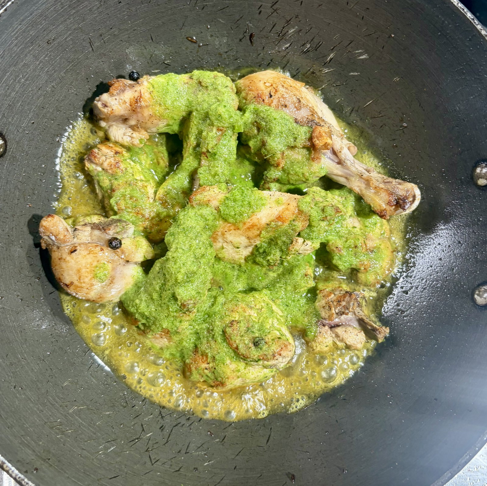 Step 4.1: Pour the prepared green paste and the reserved marinade juice into the pan