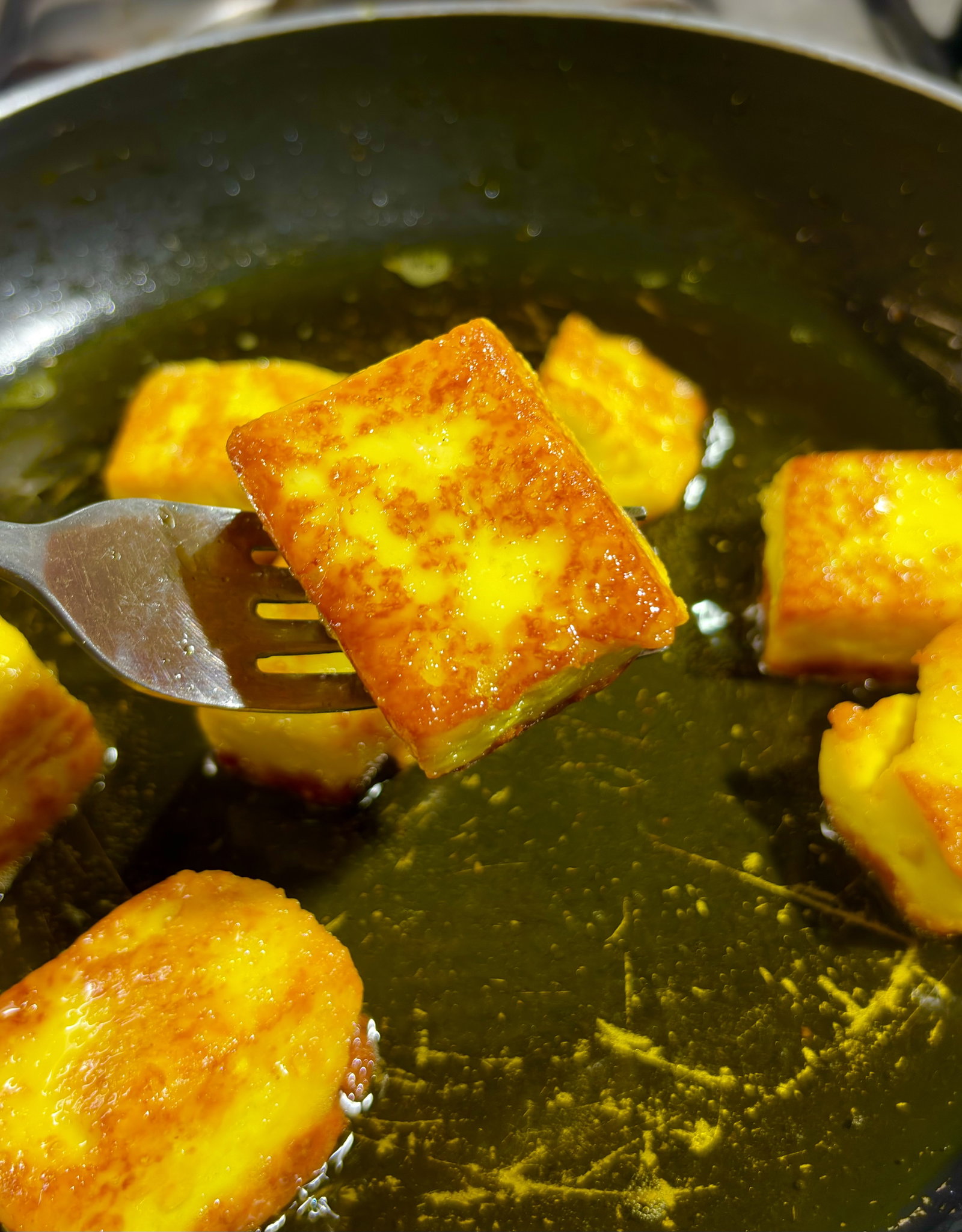 Step 2.1: Add the blanched paneer cubes and sear until lightly golden on all sides