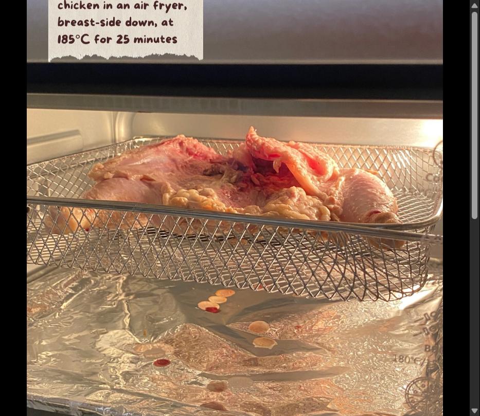 Step 3.1: Roast the whole chicken in an air fryer, breast-side down, at 185C for 25 minutes