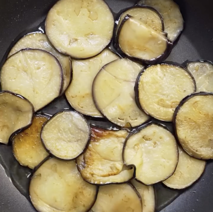 Step 1.1: Sear the eggplant slices in a hot pan with olive oil until they develop color