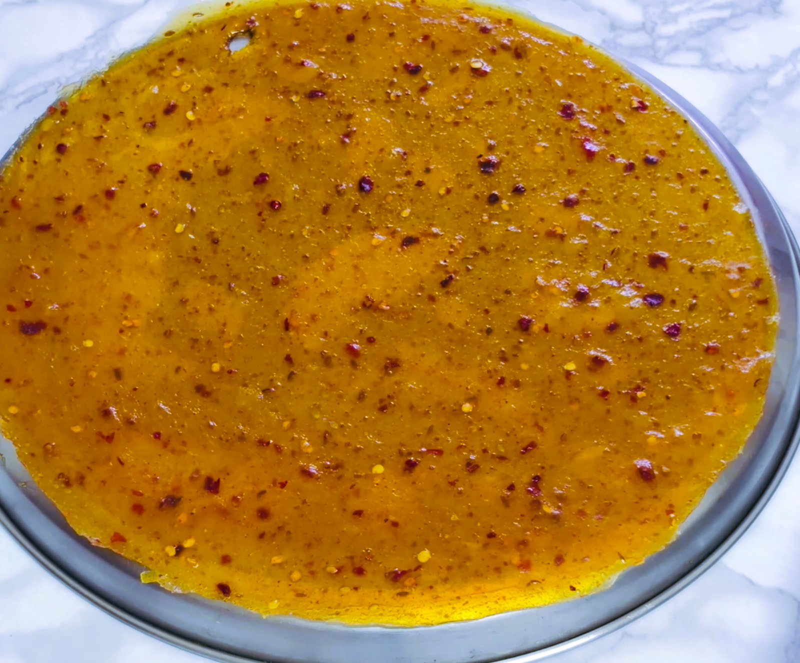 Step 5.1: Transfer the mango sheet onto a clean board or to the back of the thali