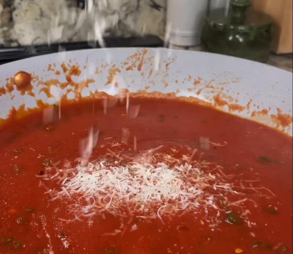 Step 3.1: Stir in chopped parsley, salt, pepper, red pepper flakes, and grated Parmesan