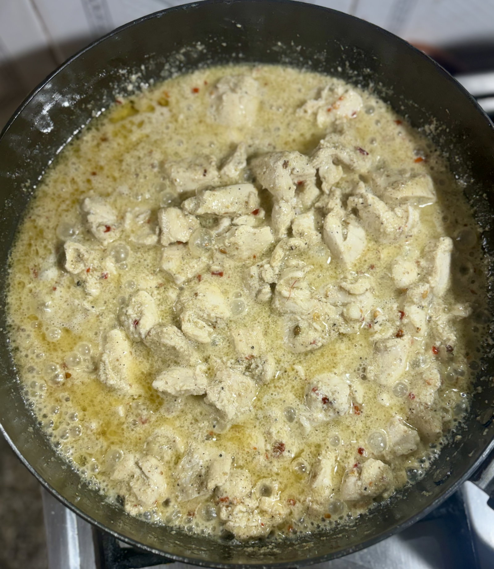 Step 3.1: Stir gently and cook until the chicken is cooked through and the sauce begins to thicken