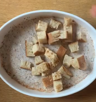Step 1.1: Cut the crumpets into small squares and mix them with the batter until fully absorbed