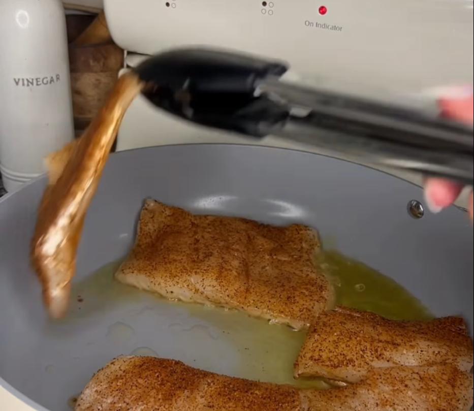 Step 1.1: Heat olive oil in a sauté pan over medium heat and cook cod for about 4 minutes per side until golden and cooked through
