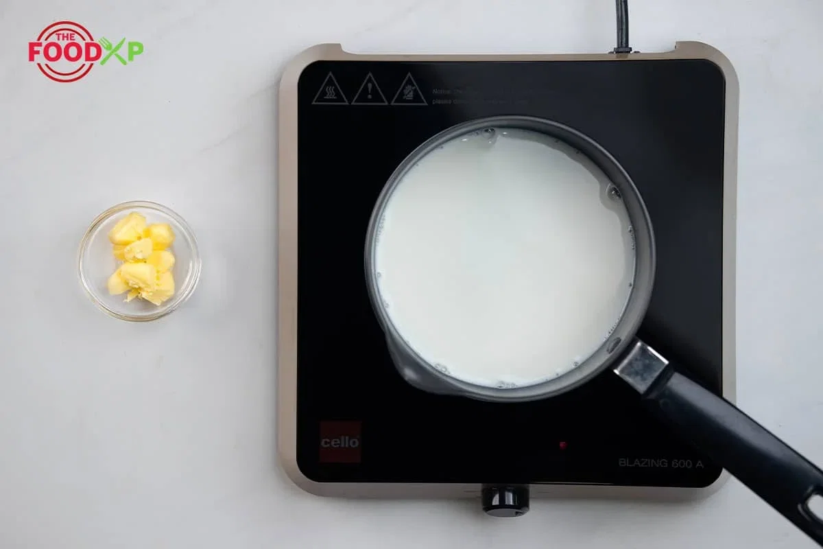 Step 1.1: Heat ¾ cup whole milk and add unsalted butter in a small milk pan over medium, stirring occasionally, until the butter is melted, about 4 minutes