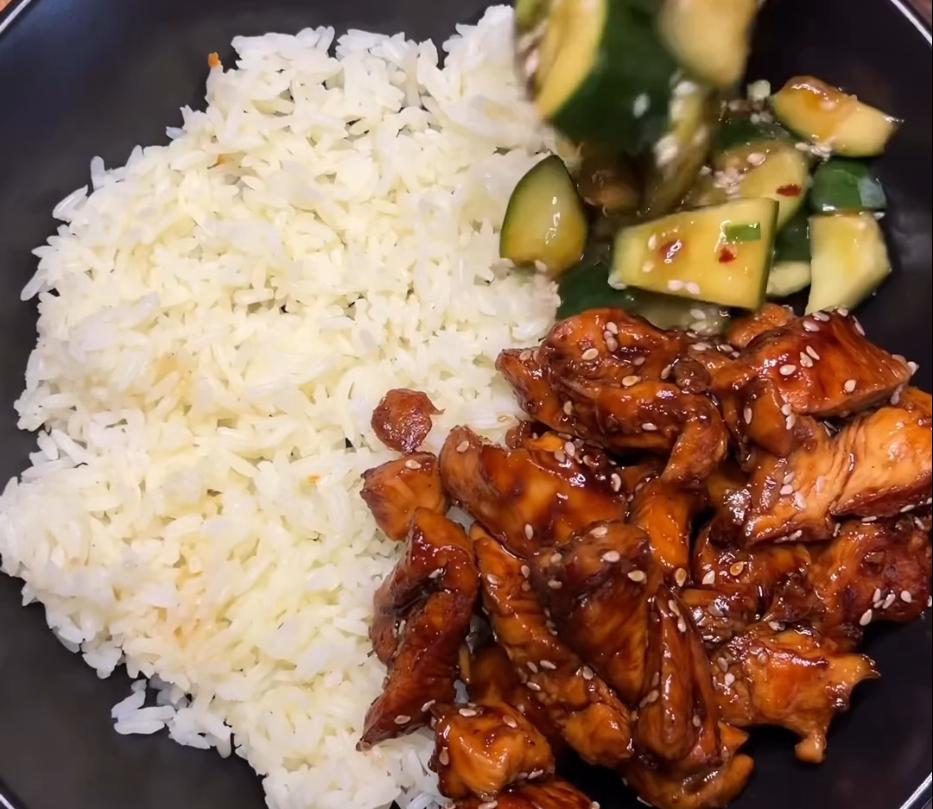 Step 4.1: Serve chicken with steamed jasmine rice, edamame beans, and garnish with spring onion and sesame seeds