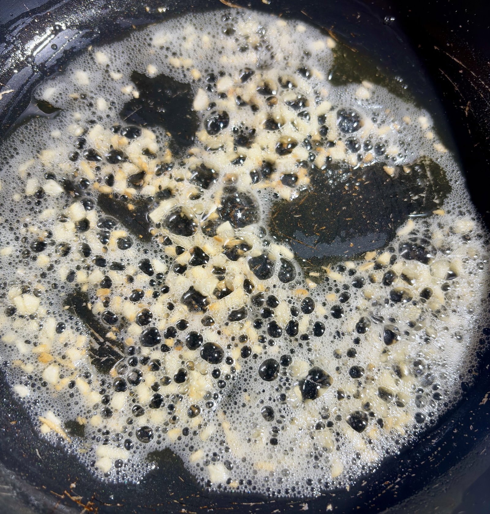 Step 2.1: Add the finely chopped garlic and sauté for a few seconds until fragrant