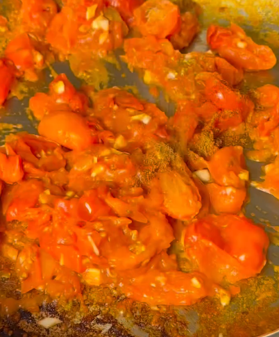 Step 1.1: Heat olive oil in a pan and sauté the cherry tomatoes until soft and slightly blistered