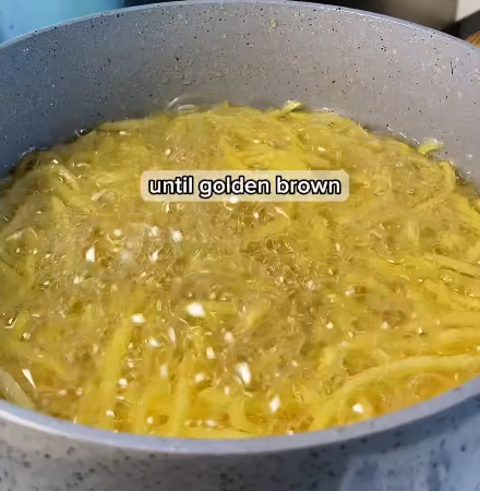 Step 1.1: Heat oil in a deep pan and fry the potato strips in batches until crispy and golden