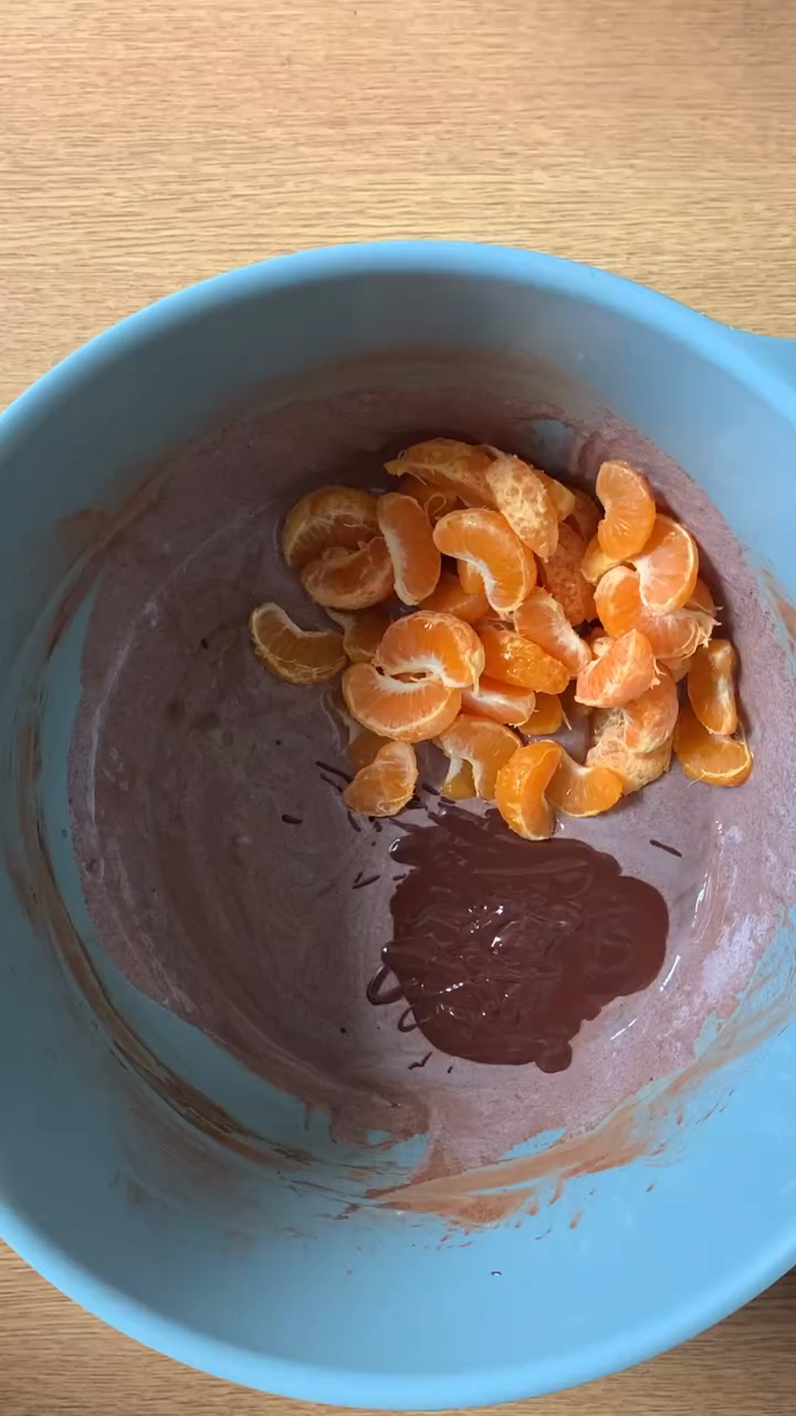 Step 1.1: Add peeled and separated clementines to the mixture and ensure they are well coated
