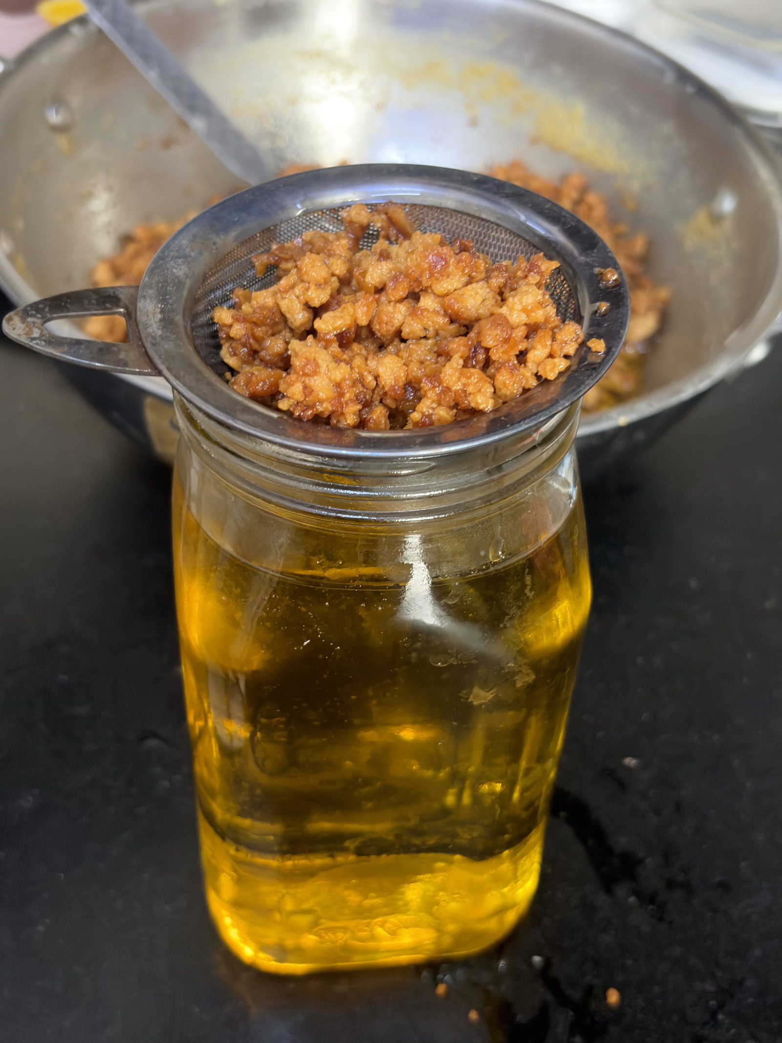 Step 3.1: Carefully pour the golden liquid through the strainer