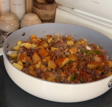 Step 1.1: Mix in bell pepper, onion, potatoes, garlic, and seasonings