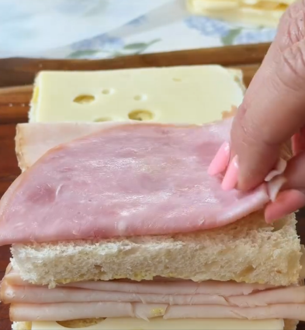Step 1.1: Build your sandwich by layering bread → Swiss → ham → turkey → bread → turkey → ham → Swiss → bread