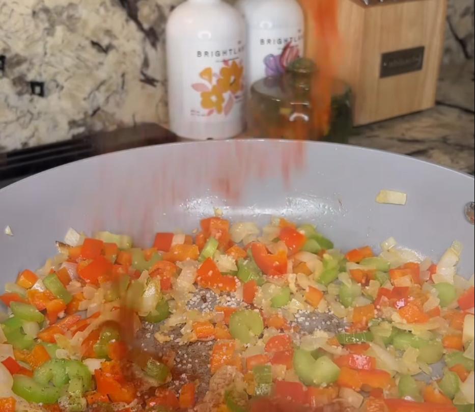 Step 2.1: Stir in minced garlic, paprika, chili powder, salt, and pepper