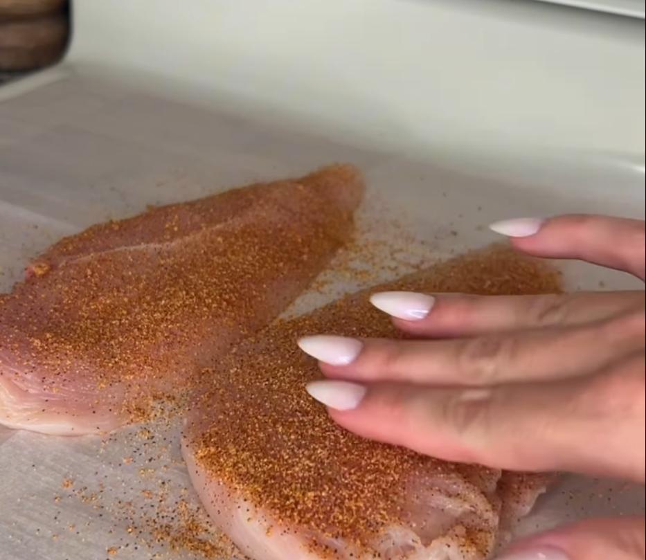 Step 2.1: Season both sides of chicken with creole seasoning