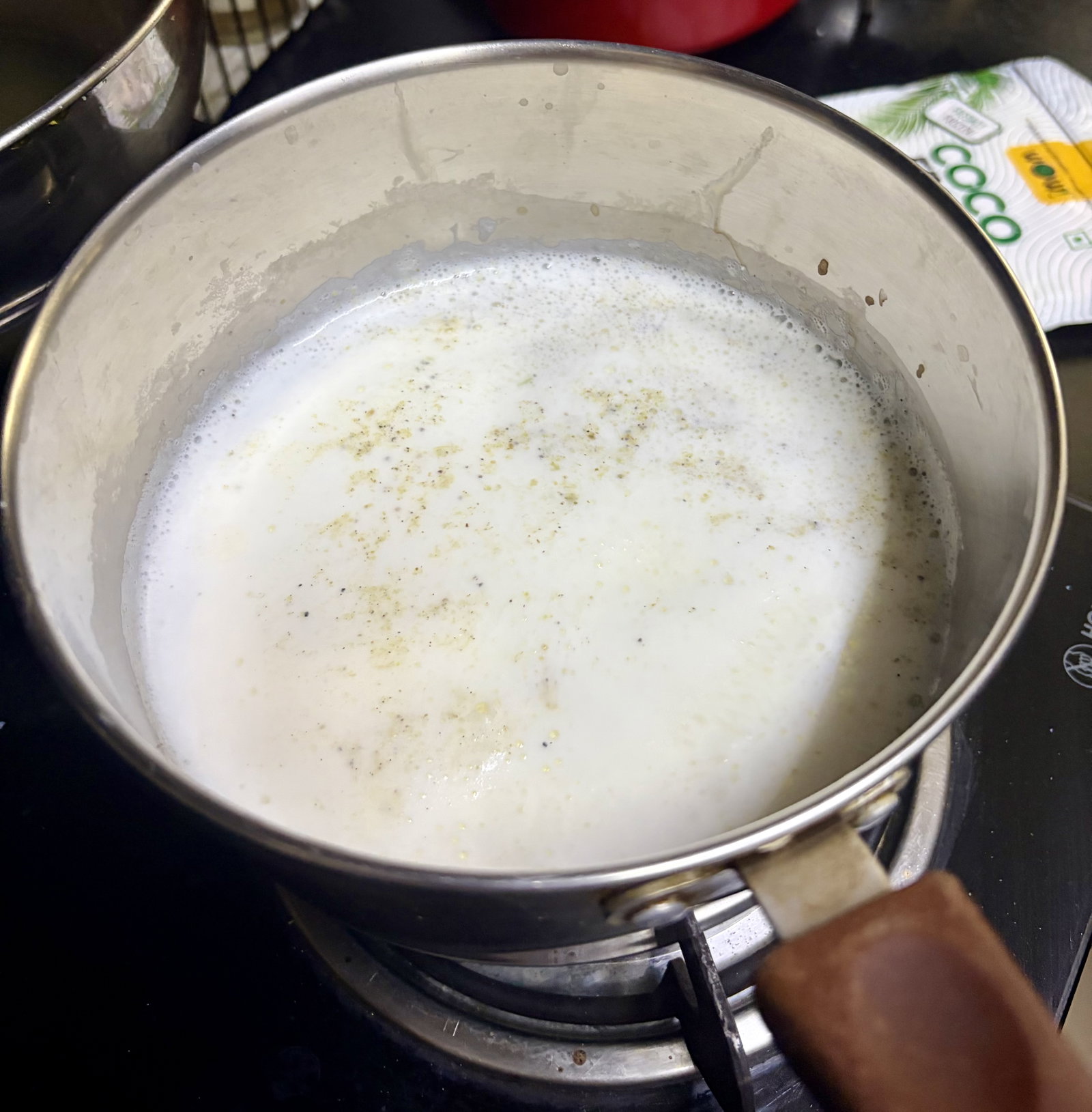 Step 2.1: Boil the milk with the cardamom powder in a heavy-bottomed pot