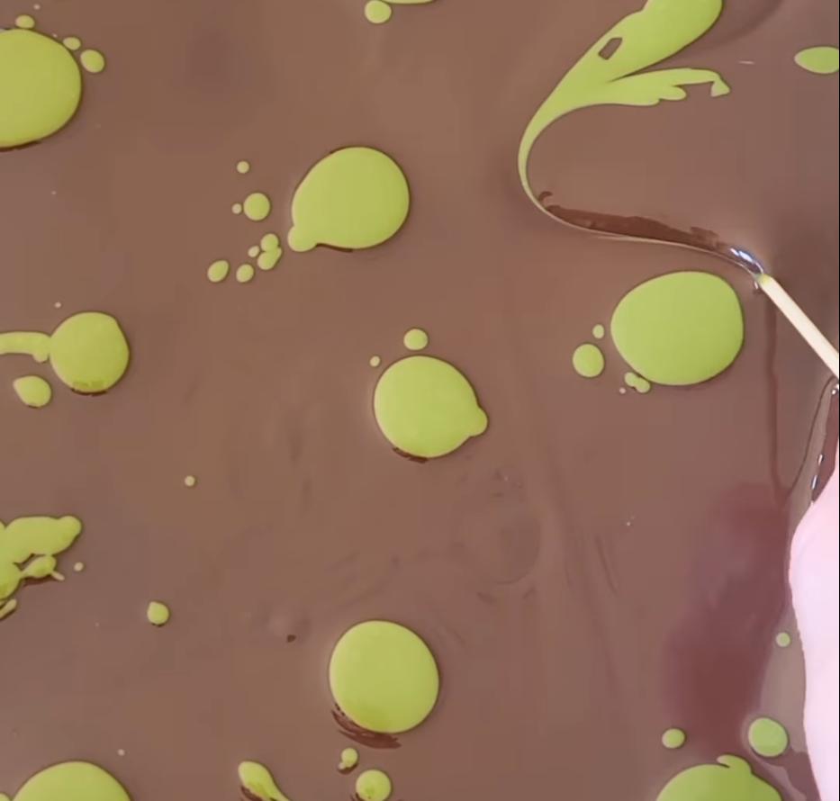 Step 1.1: Swirl the chocolates together using a cocktail stick to create a marbled effect