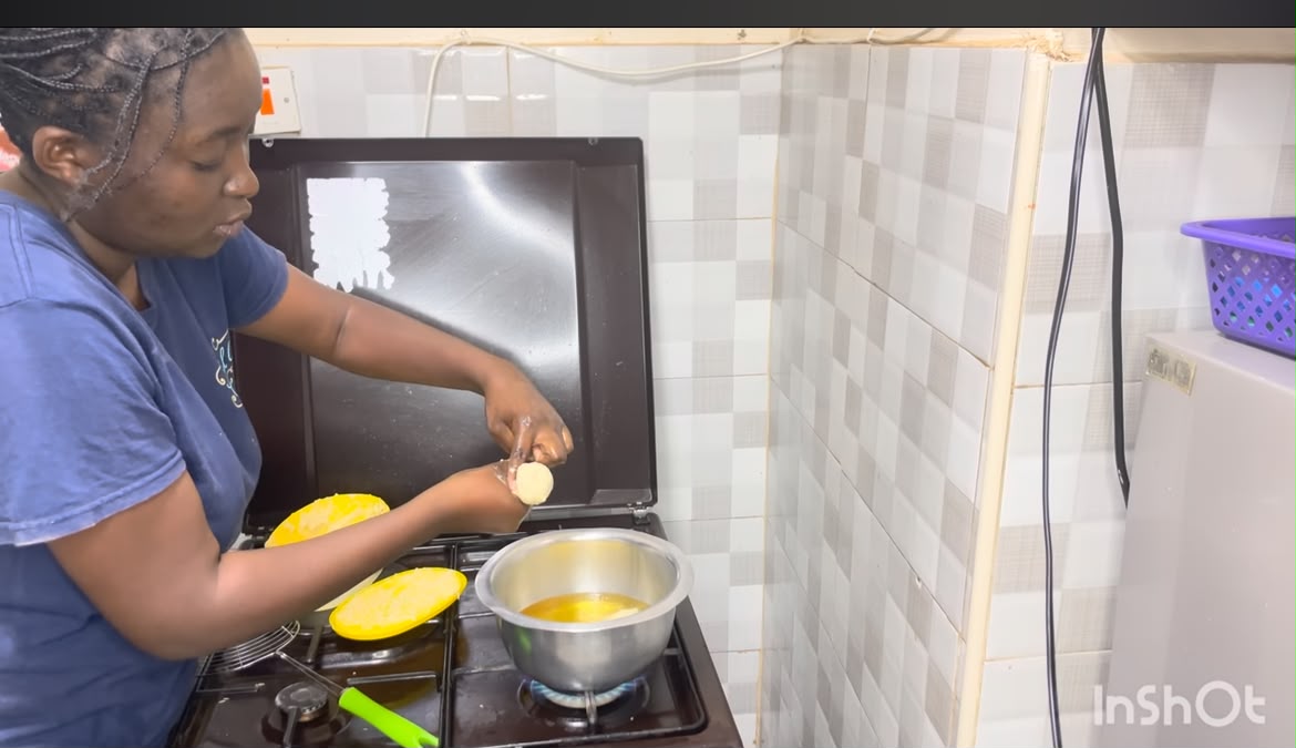 Step 4.1: Using your hand or two spoons, scoop small portions of the dough and gently drop them into the hot oil