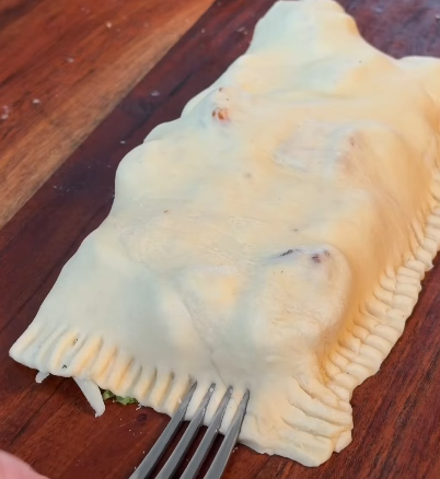 Step 1.1: Seal the dough tightly around the filling to form a pocket