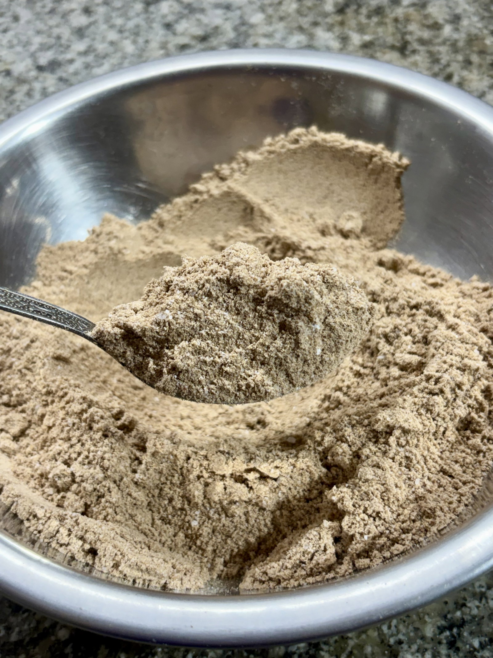 Step 2.2: Add the powdered sugar and mix thoroughly, breaking up any lumps with your fingers or a spoon to ensure a smooth texture