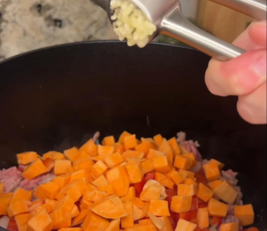 Step 1.1: Add onion, bell pepper, sweet potatoes, and garlic, and sauté until fragrant