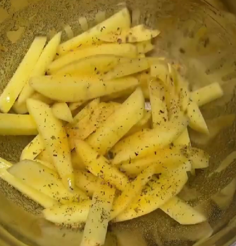 Step 1.1: Dry potatoes completely, then add to a bowl with olive oil, chicken salt, and mixed herbs