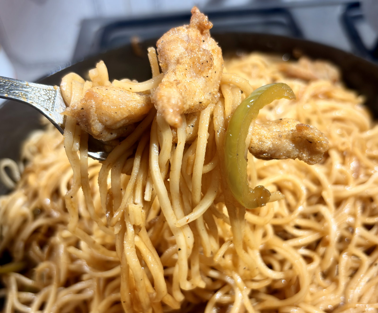 Step 3.1: Add the fried chicken back into the pan and toss everything together for another 1–2 minutes until sizzling hot