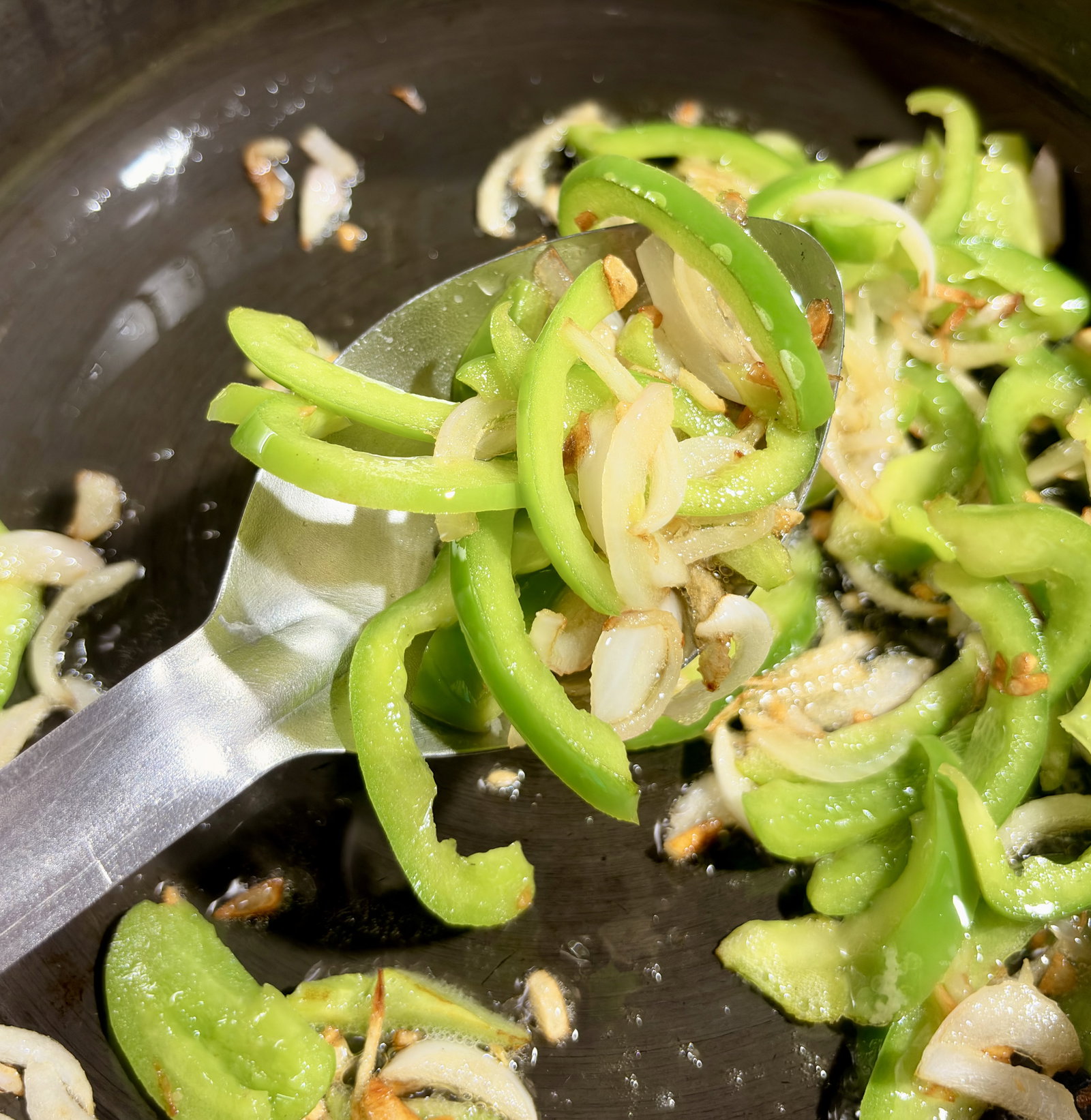 Step 3.1: Add the sliced onion and capsicum